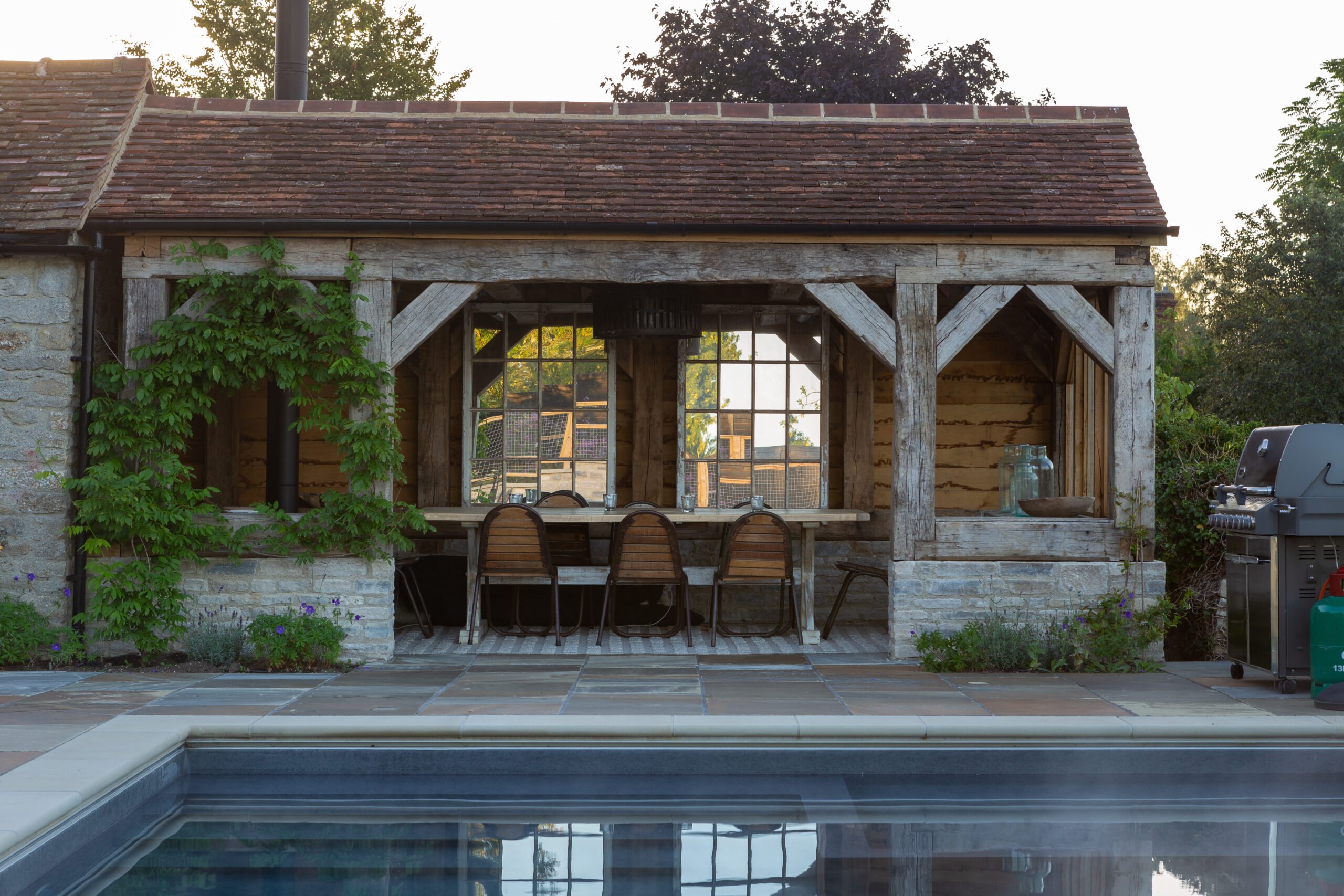 Reclaimed oak rustic timber al fresco dining pavilion outdoor pool garden designers