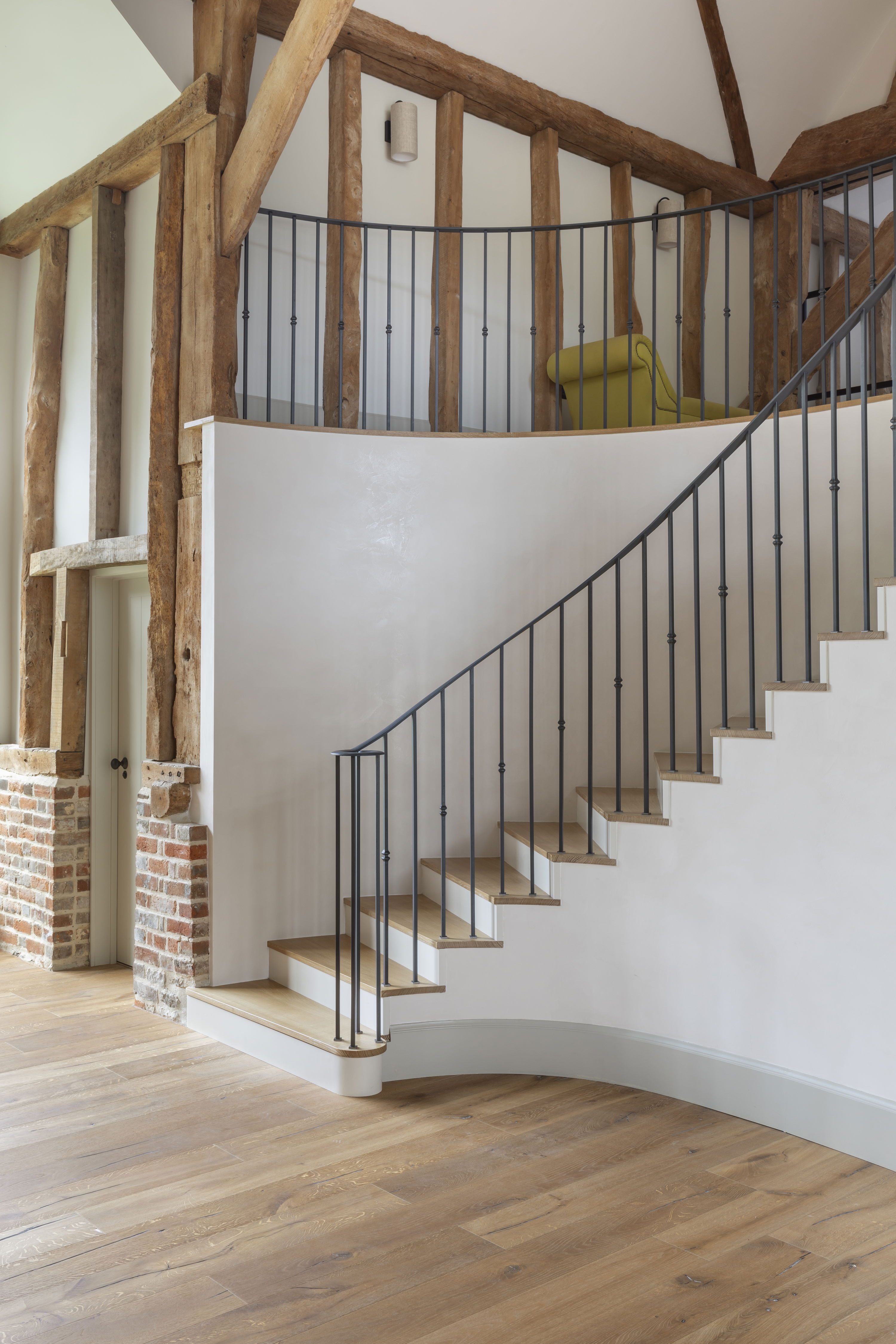 Sweeping staircase in barn conversion